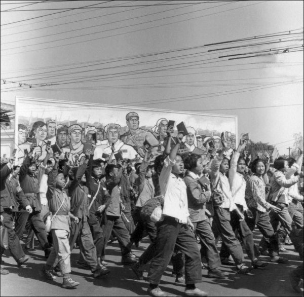 Red Guards, high school and university students, waving copies of Chairman Mao Zedong's "Little Red Book," parade in June 1966 in Beijing's streets at the beginning of the Great Proletarian Cultural Revolution. Since the May 1966 launch of the Cultural Revolution at Beijing University, the Red Guards were instrumental in Mao's recapture of power after the failure of the Great Leap Forward. The movement was directed against "party leaders in authority taking the capitalist road." The Red Guards went on rampage in Chinese towns, terrorizing people, particularly older ones. (Photo by JEAN VINCENT / AFP) 