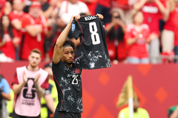 VANCOUVER, BRITISH COLUMBIA - JUNE 18: Nathan Saliba #25 of Canada shows the shirt of Ismael Kone #8 as the celebration after scoring the team's fourth goal during the FIFA World Cup 2026 Group B match between Canada and Qatar at BC Place Vancouver on June 18, 2026 in Vancouver, British Columbia. 