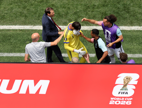 INGLEWOOD, CALIFORNIA - JULY 10: Rudi Garcia, Head Coach of Belgium, and teammates console Thibaut Courtois #1 as he is substituted during the FIFA World Cup 2026 Quarter Final match between Spain and Belgium at Los Angeles Stadium on July 10, 2026 in Inglewood, California. 