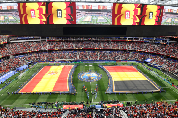 Spain and Belgium flags are displayed on the pitch ahead of the 2026 World Cup football tournament quarter-final match between Spain and Belgium at the Los Angeles Stadium in Inglewood on July 10, 2026. 