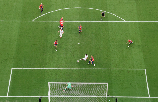 MIAMI GARDENS, FLORIDA - JULY 11: (EDITOR'S NOTE: Image was captured using a remote camera positioned above the field of play.) Jude Bellingham #10 of England scores his team's second goal during the FIFA World Cup 2026 Quarter Final match between Norway and England at Miami Stadium on July 11, 2026 in Miami Gardens, Florida.