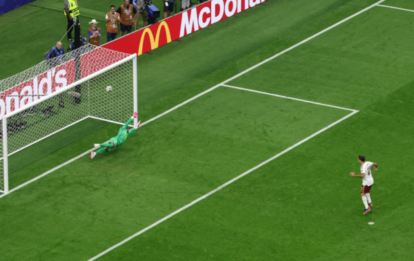 Spain's forward #21 Mikel Oyarzabal scores his team's first goal from the penalty spot during the 2026 World Cup football tournament semi-final match between France and Spain at the Dallas Stadium in Arlington on July 14, 2026.