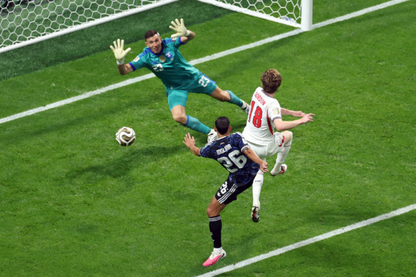 England's forward #18 Anthony Gordon scores his team's first goal past Argentina's goalkeeper #23 Emiliano Martinez during the 2026 World Cup football tournament semi-final match between England and Argentina at the Atlanta Stadium in Atlanta on July 15, 2026.